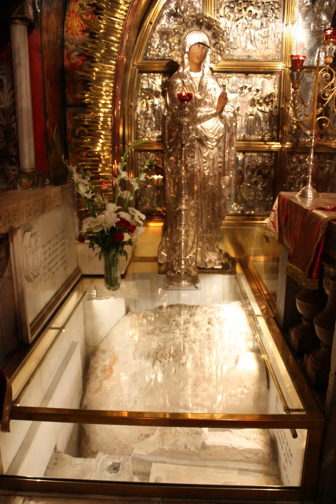 Calvary stone and icon at the Church of the Holy Sepulchre