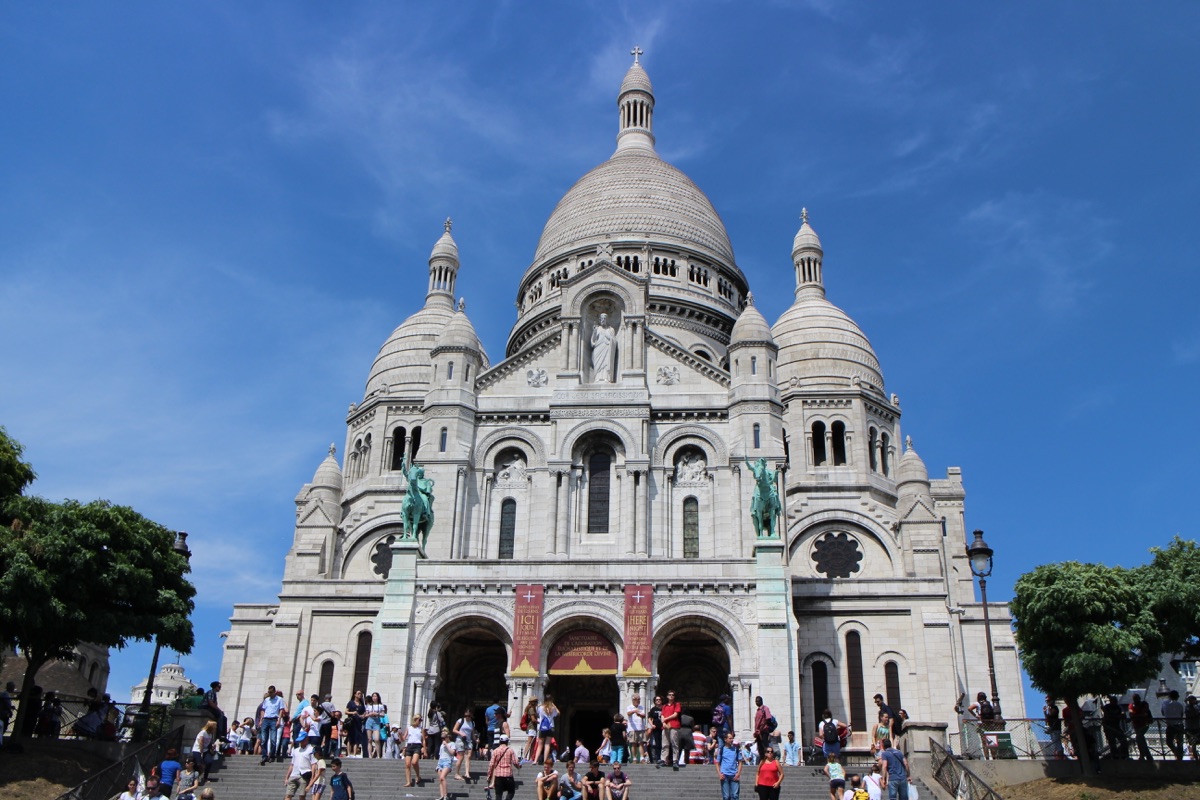 The white basilica of Sacre-Coeur rising above Montmartre in Paris.
