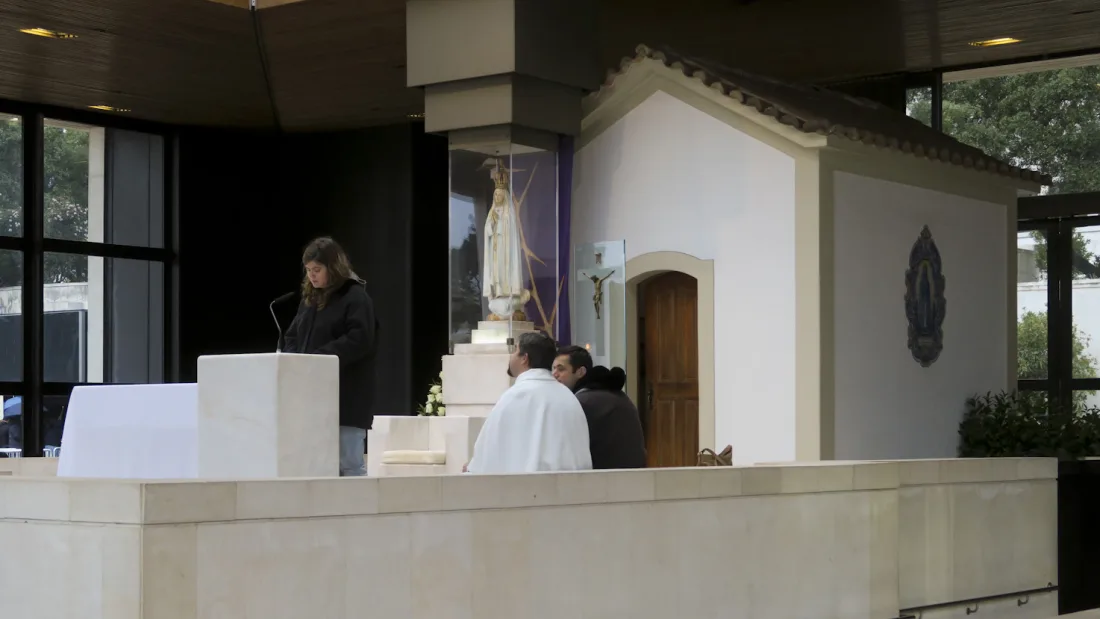 The Chapel of the Apparitions at the Sanctuary of Fatima, with the altar and Capelinha structure visible.