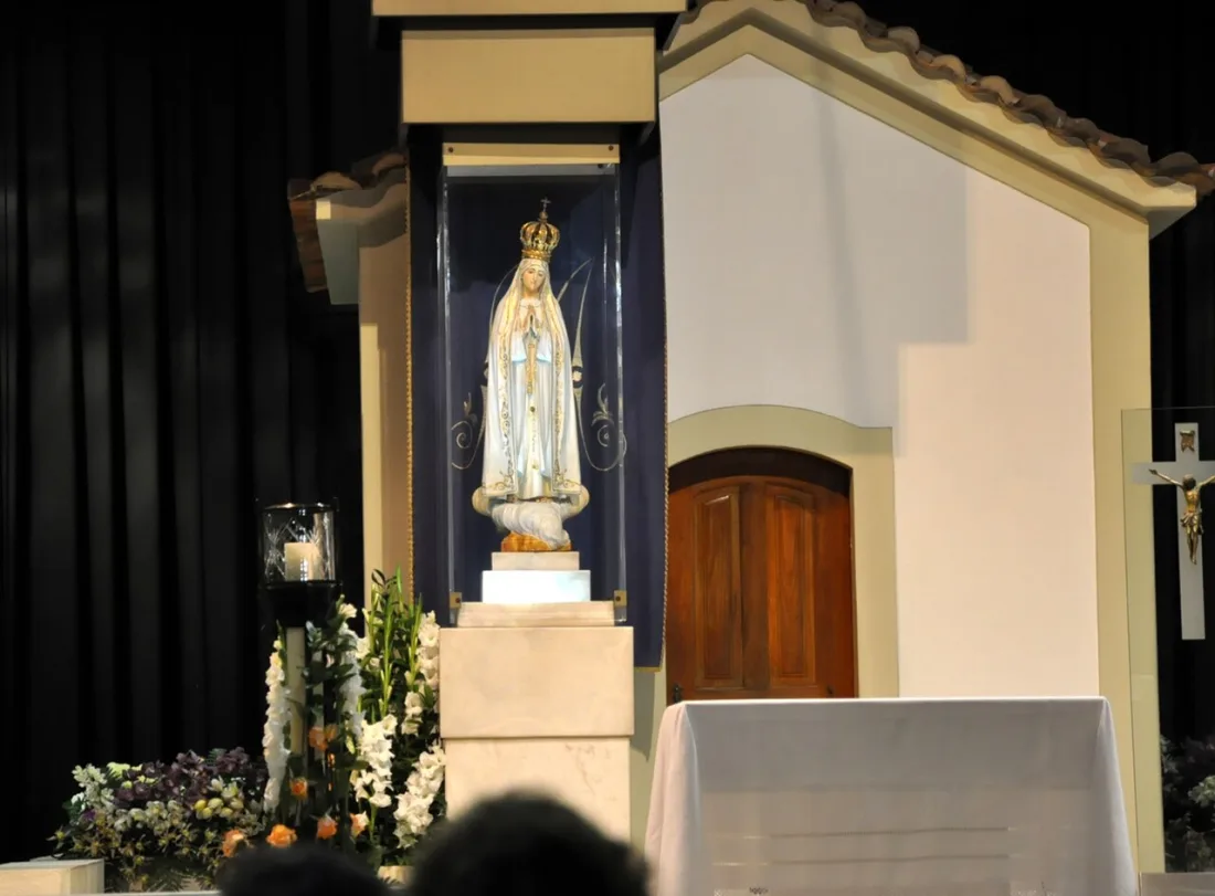 The Chapel of the Apparitions at night with the image of Our Lady of Fatima near the altar.