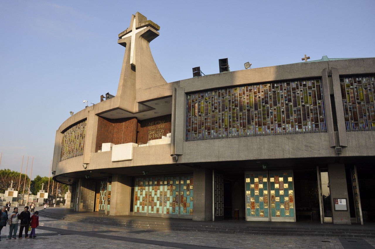 The modern circular New Basilica of Our Lady of Guadalupe in Mexico City, with its great cross over the entrance.