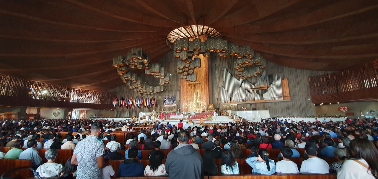 Mass in the New Basilica of Guadalupe, with the tilma image above the high altar.