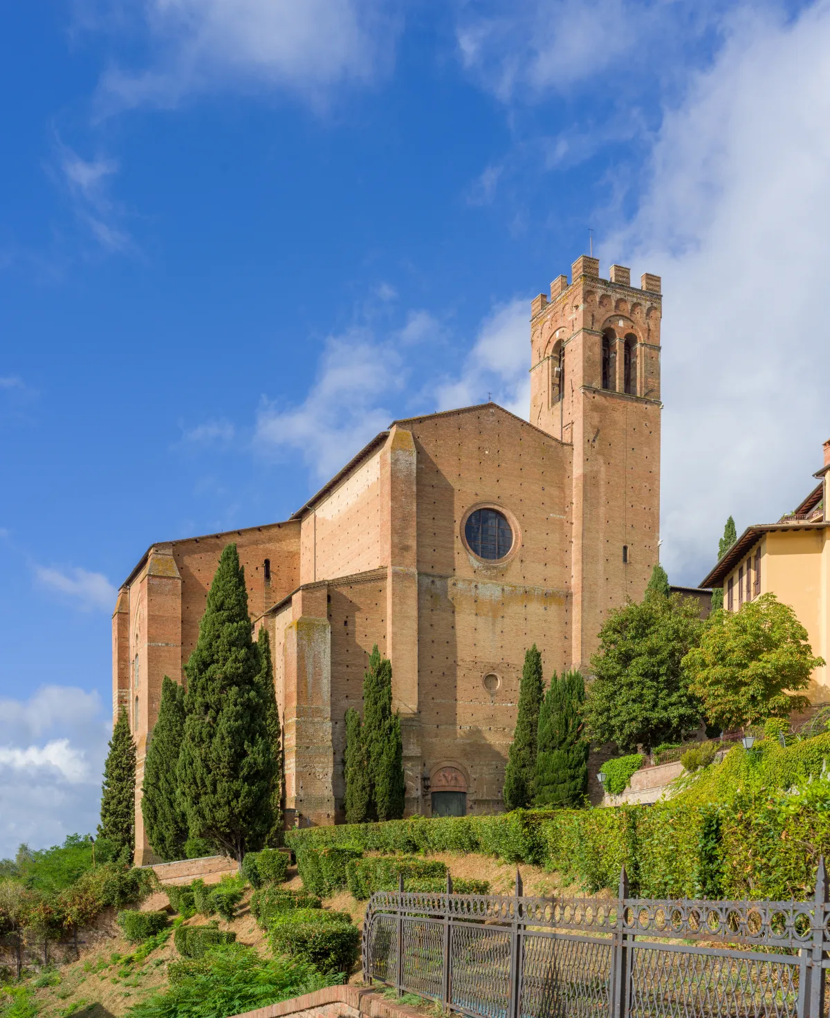 The brick Basilica of San Domenico on its rise above Siena.