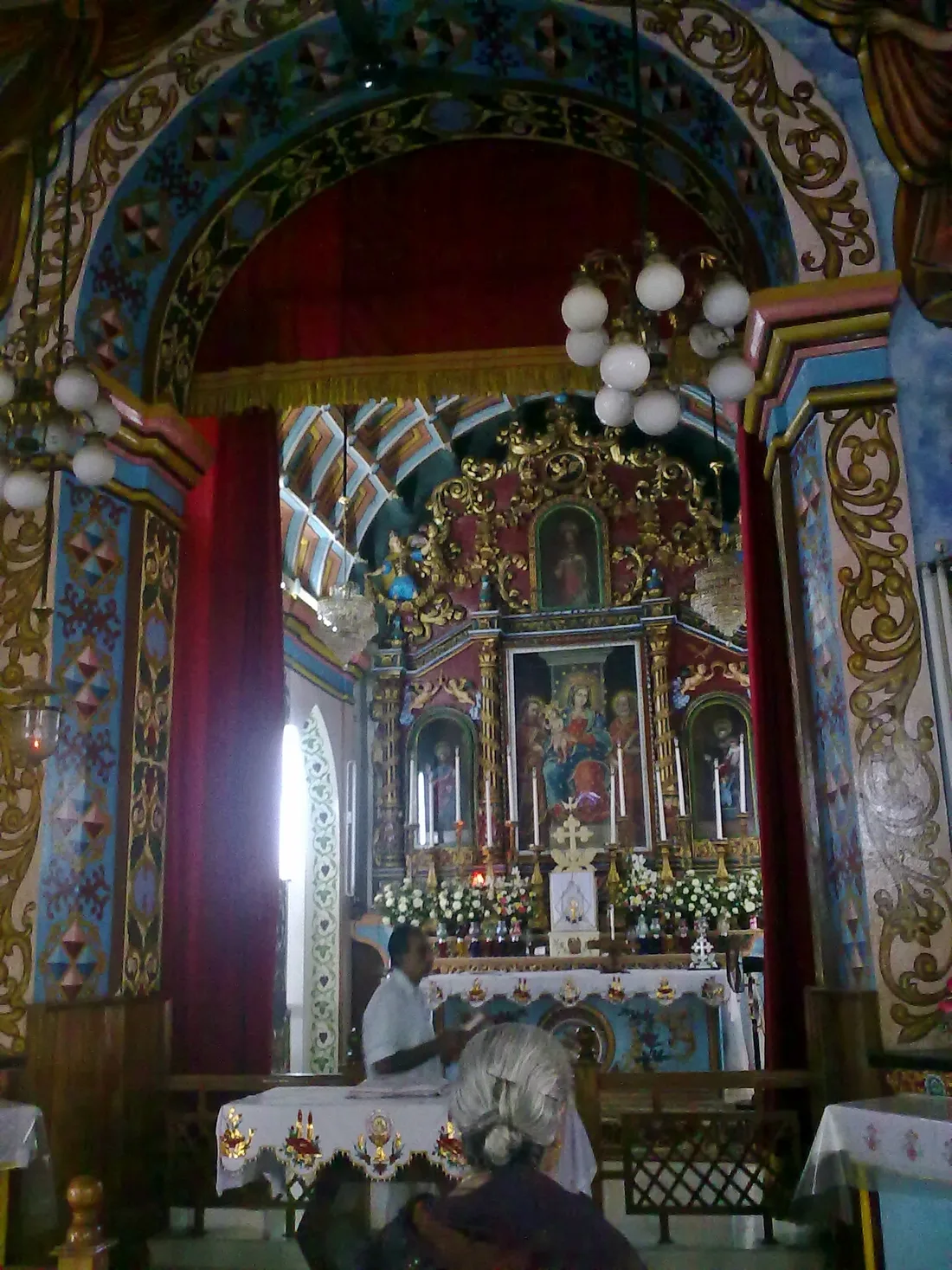 The painted and gilded altarpiece of St. Mary's Church at Kudamaloor in Kerala.