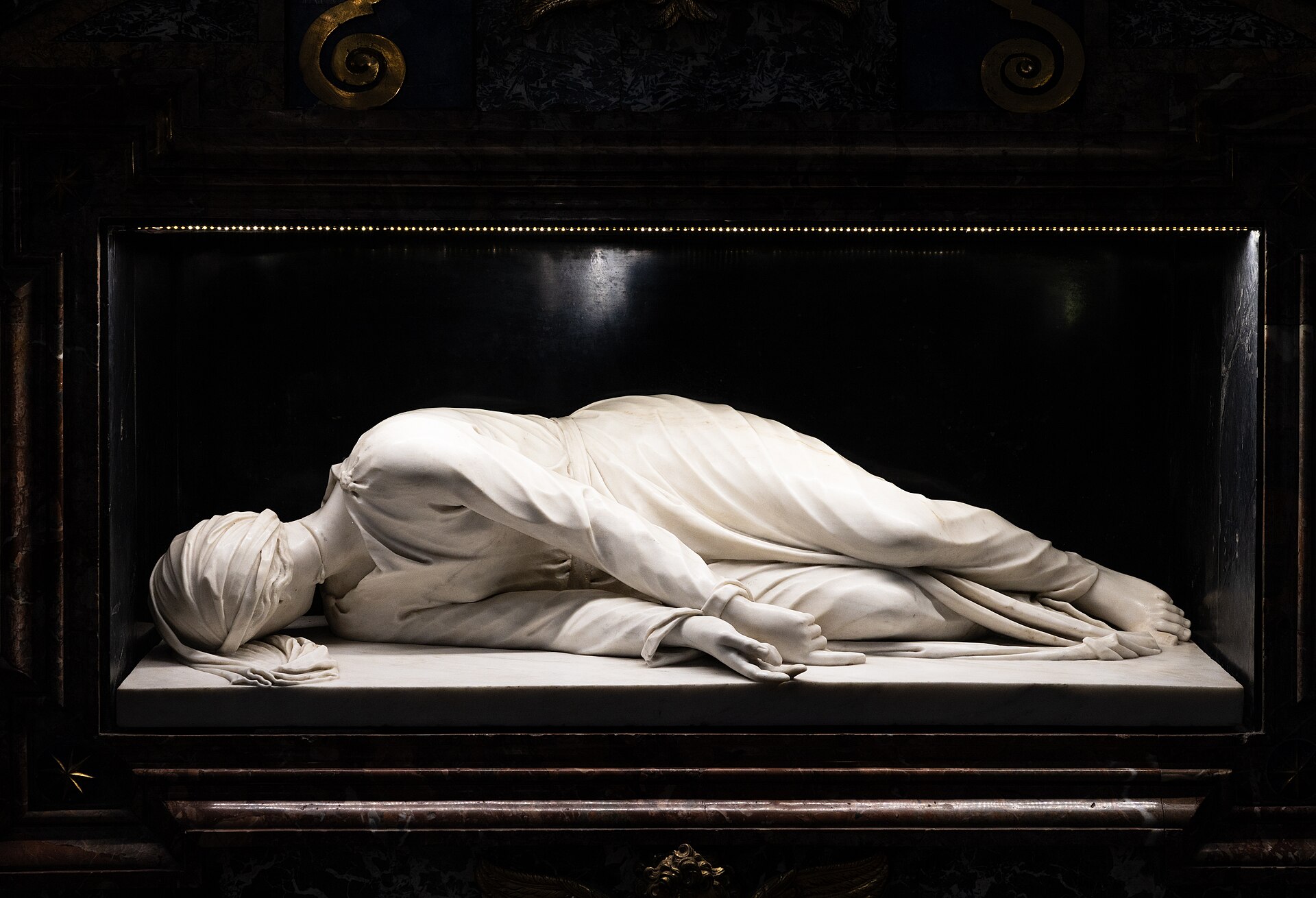 Stefano Maderno's marble statue of Saint Cecilia beneath the high altar, Santa Cecilia in Trastevere