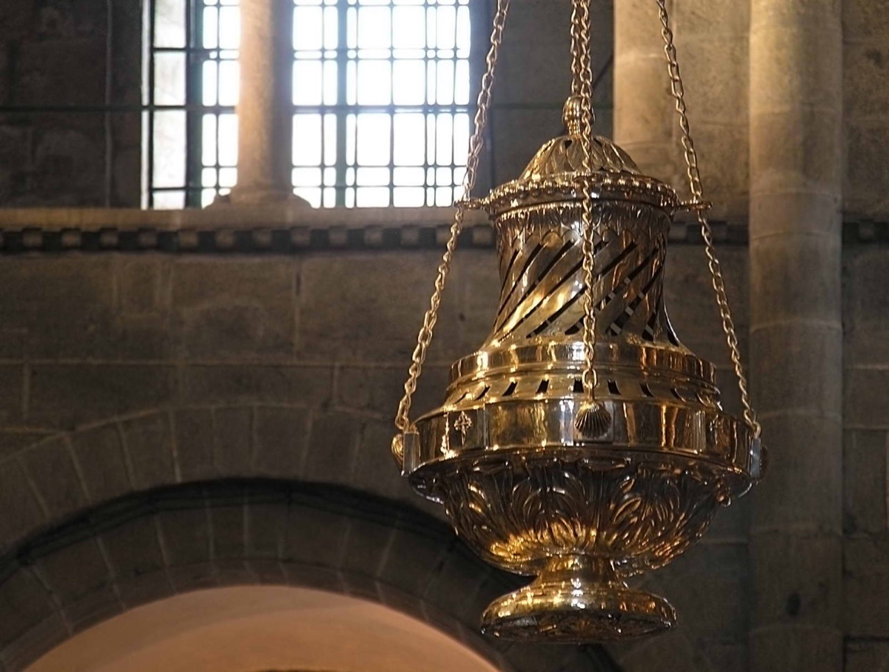 The Botafumeiro censer suspended in the transept of Santiago de Compostela Cathedral.