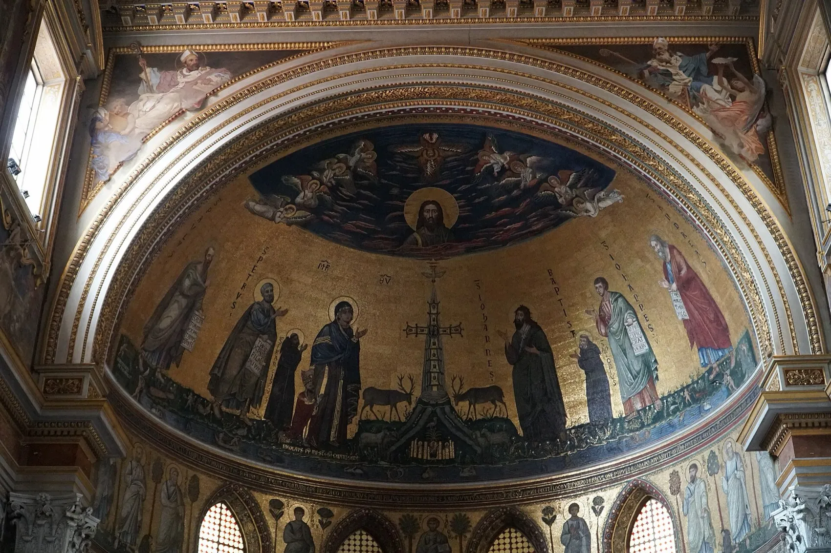 The apse mosaic of St. John Lateran with the bust of Christ and the jewelled cross on a gold ground