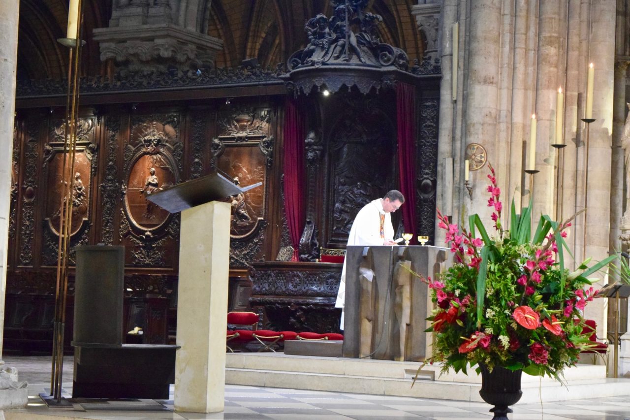 A priest celebrating Mass at the altar of Notre-Dame Cathedral in Paris before the 2019 fire.