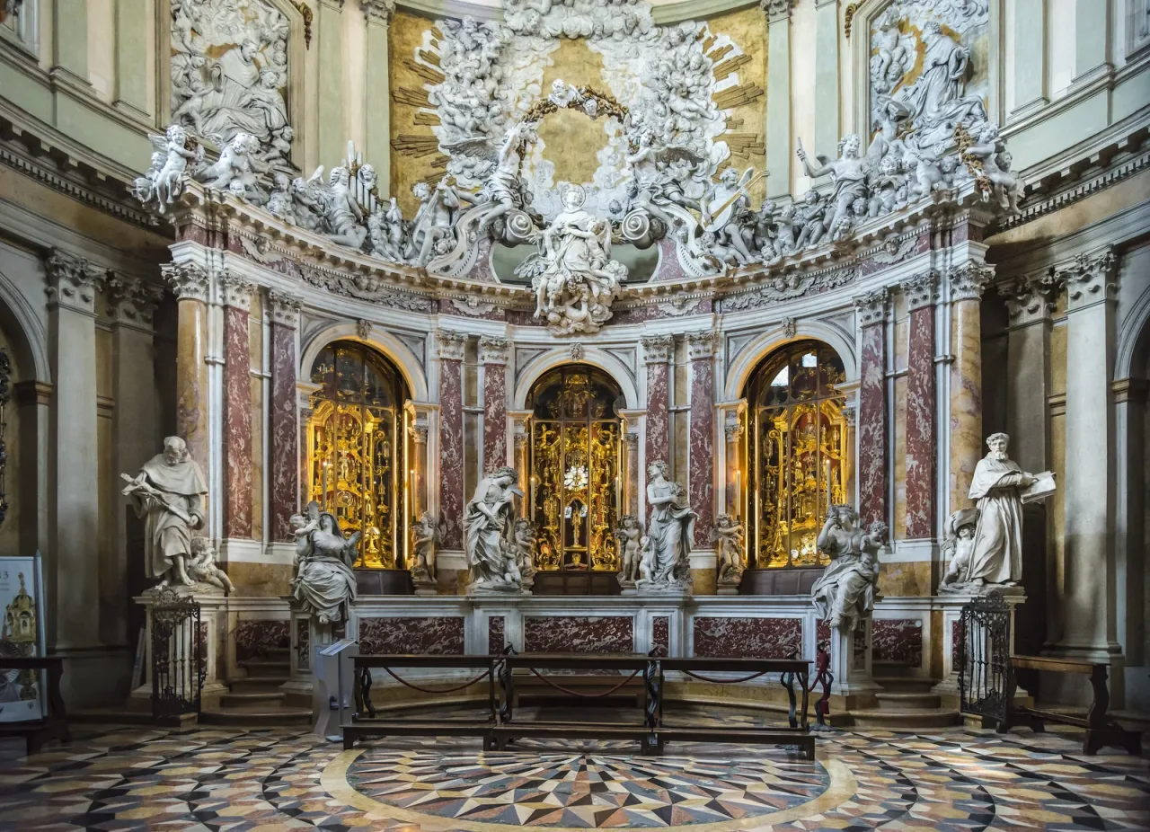 The Chapel of the Relics behind the high altar of the Basilica of Saint Anthony in Padua, a tiered marble and gilt reliquary wall by Filippo Parodi.