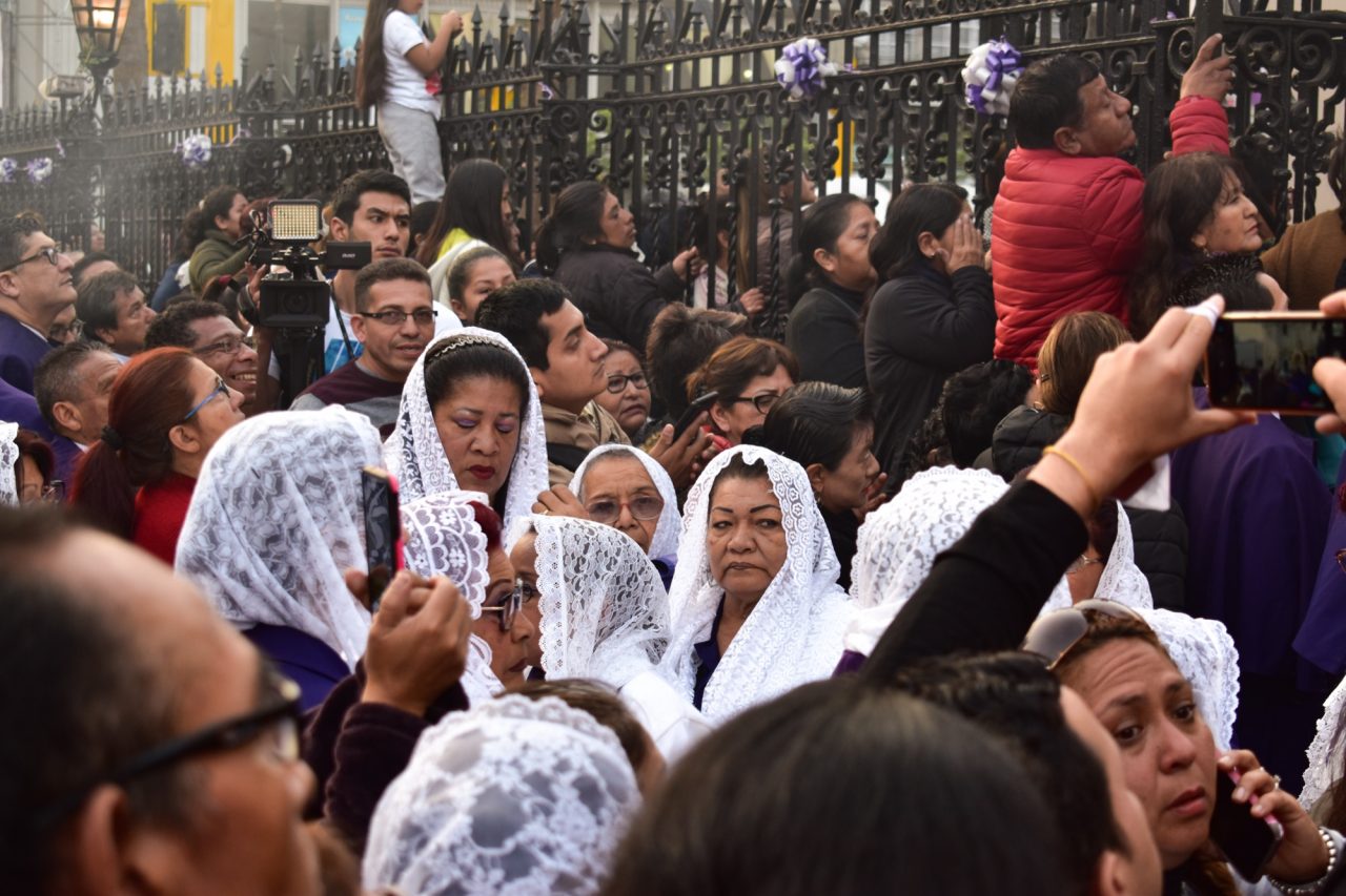 Women in the incense guild walking in the October procession of the Lord of Miracles in Lima.