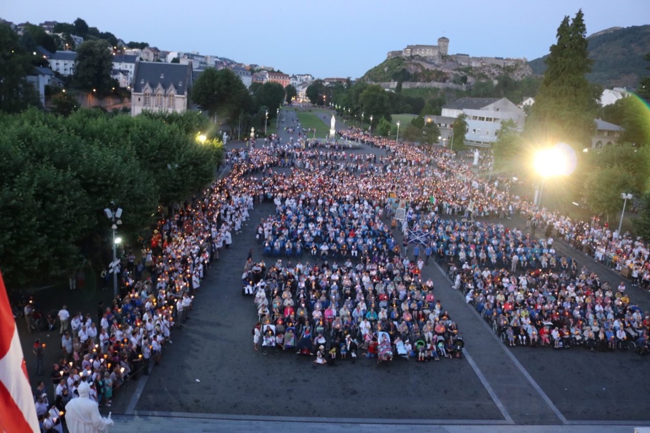 The torchlight procession crossing Rosary Square at Lourdes.