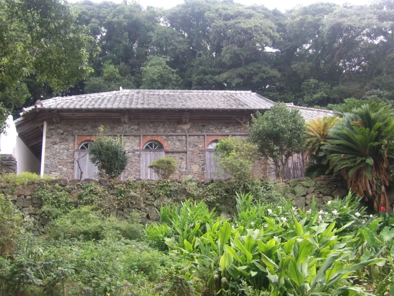 The rubble-stone outer wall of Ono Church, laid in the technique associated with Father de Rotz.