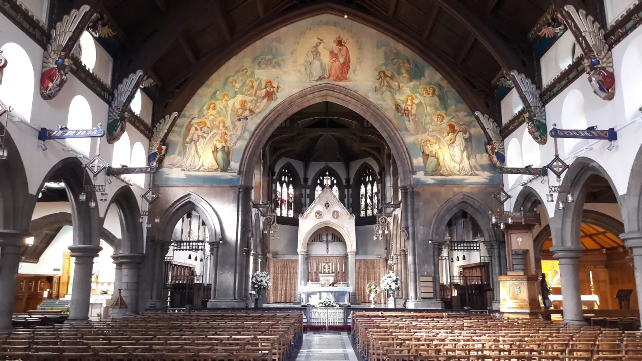 The nave and painted sanctuary of Saint Mary's Metropolitan Cathedral in Edinburgh, looking toward the high altar.