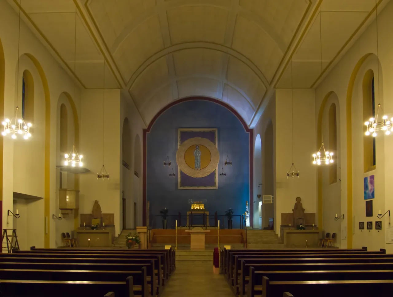 The interior of the parish and pilgrimage church of Saint Hildegard at Eibingen, with the gilded reliquary shrine on the altar platform.