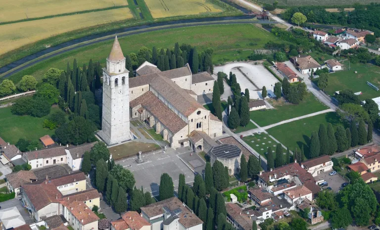 The Basilica of Santa Maria Assunta at Aquileia and its campanile seen from the air.