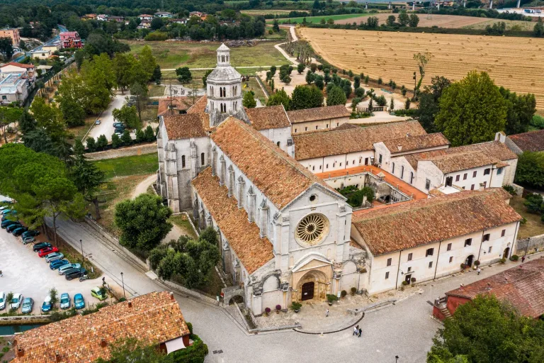 The Cistercian abbey of Fossanova at Priverno seen from the air amid its fields.