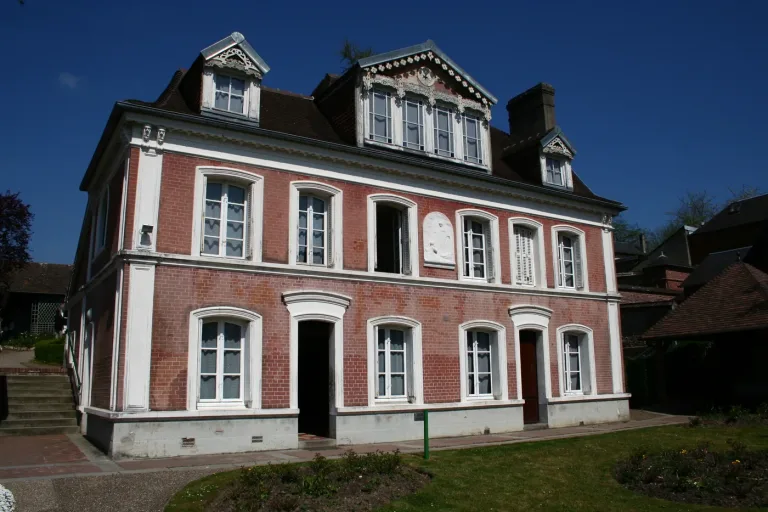 Les Buissonnets, the Martin family house in Lisieux, its pale render and shuttered windows set behind a garden.