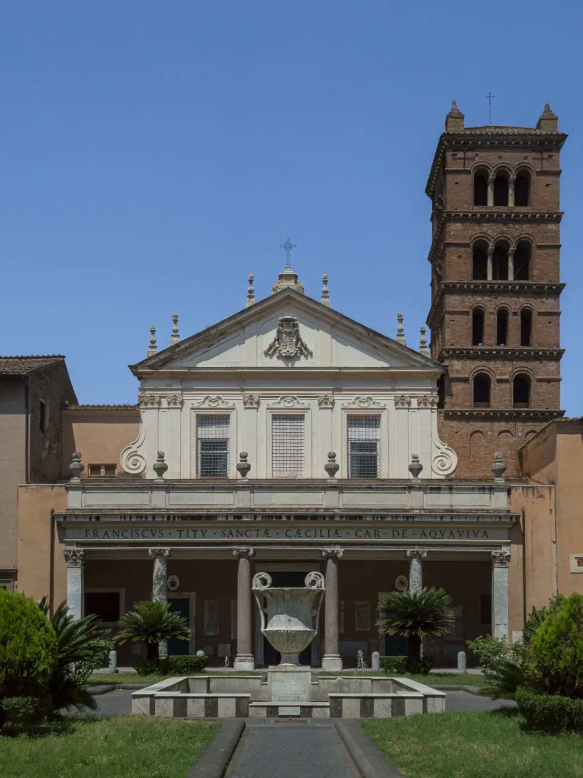 The Baroque facade and walled forecourt of the basilica of Santa Cecilia in Trastevere, Rome