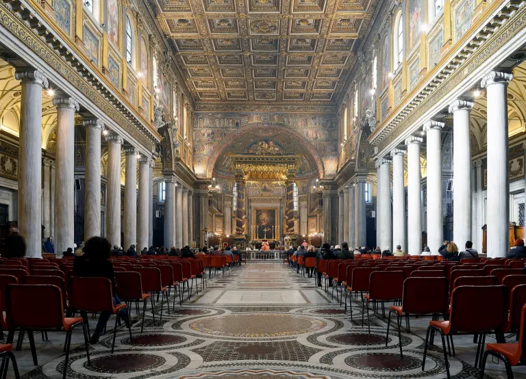 The nave of Santa Maria Maggiore with its colonnade, gilded ceiling, and Cosmatesque floor
